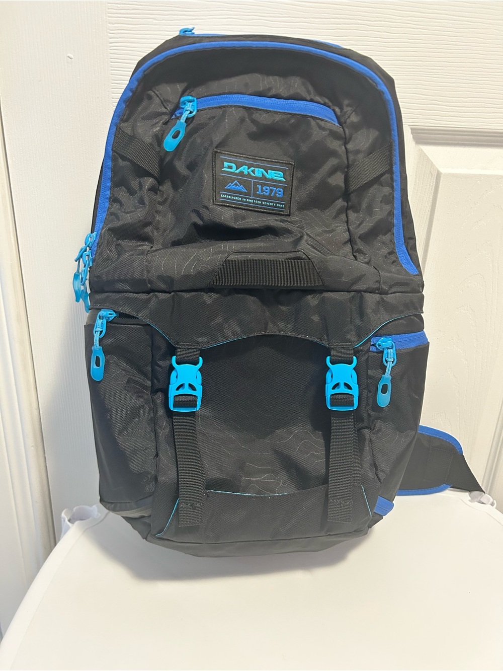 Dakine Black Backpack with Teal and Bright Blue Accents